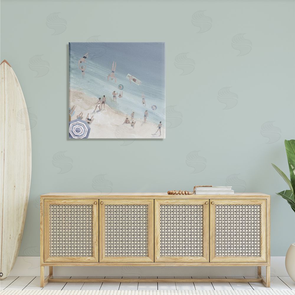 Avery Tillmon Muted Blue Aerial Beach Scene Ocean Coast Crowd Canvas Wall Art in Room