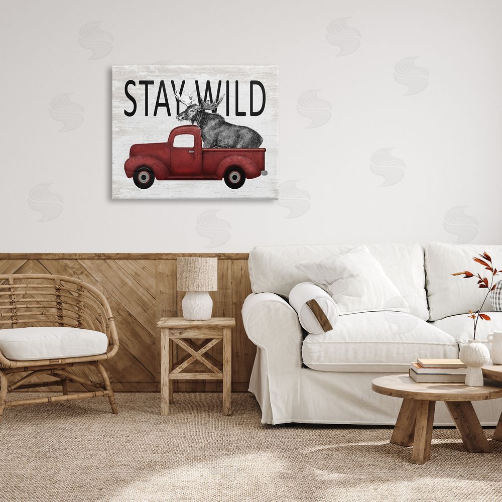 Lettered and Lined Stay Wild Moose Antique Red Pickup Truck Canvas Wall Art Print in Room