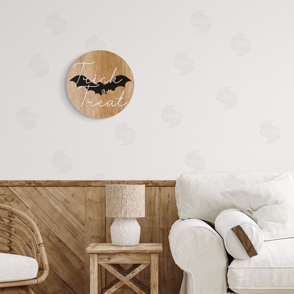 Stupell Studio Rustic Trick Or Treat Phrase Round Wall Plaque Art Print in Room