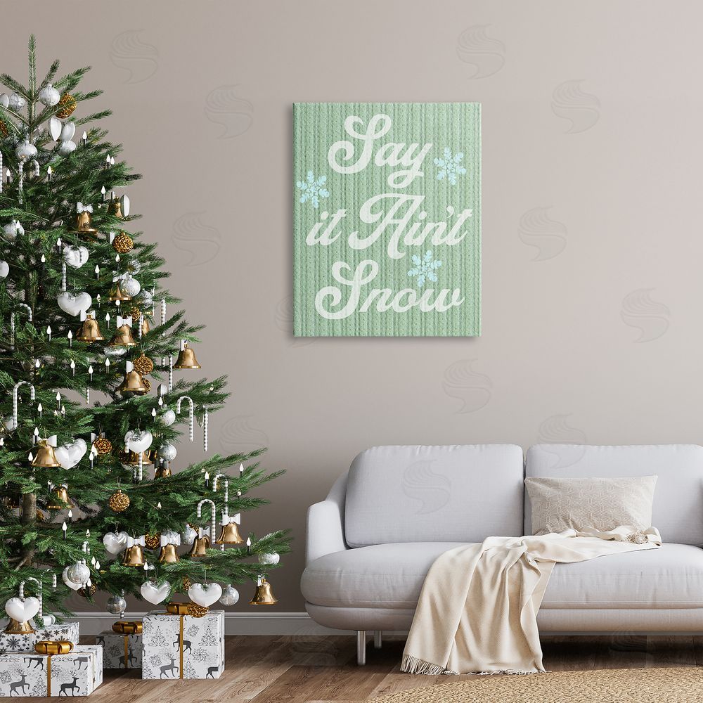 Stupell Studio Green Say It Ain't Snow Canvas Wall Art Print in Room