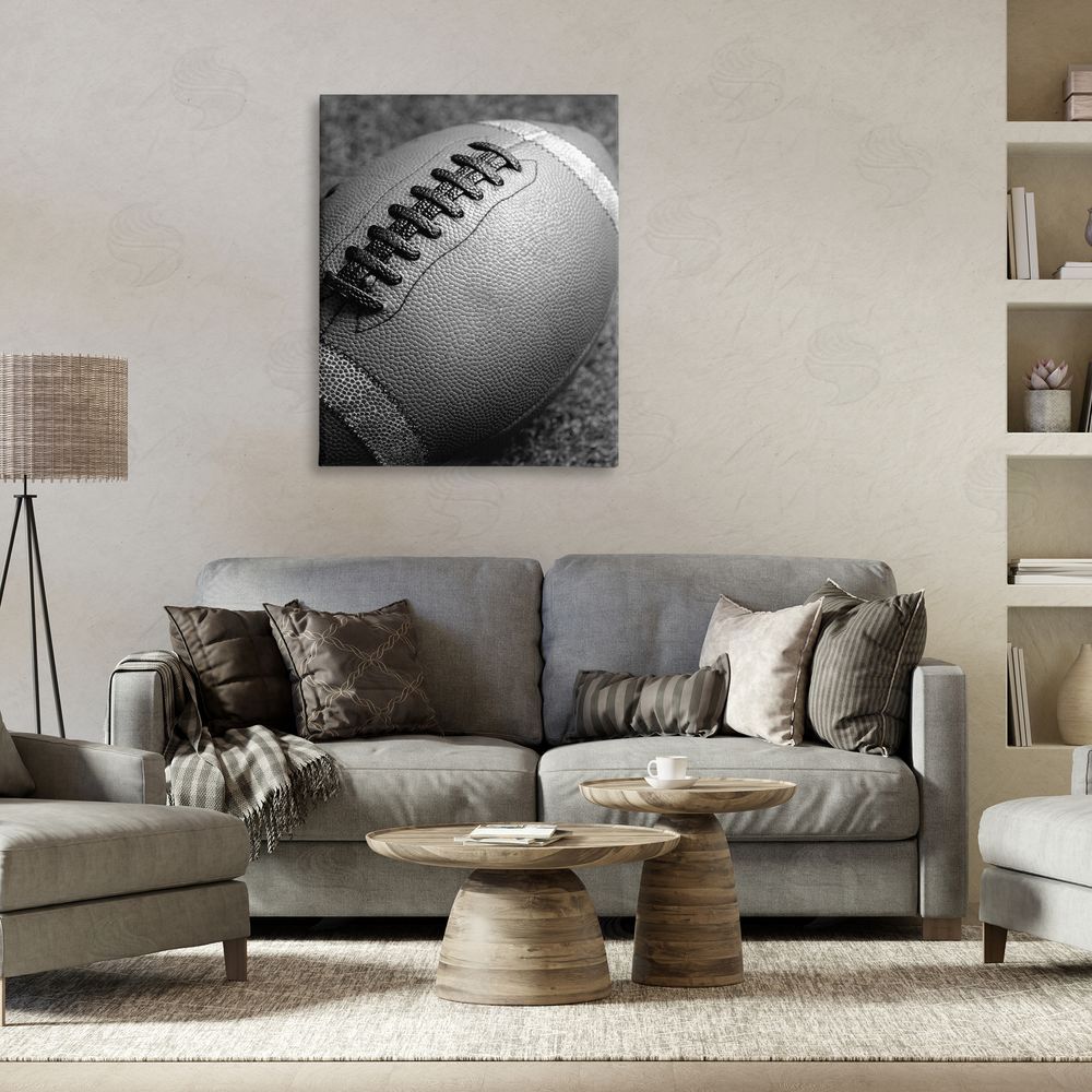 Stupell Studio Close Up Football Canvas Wall Art Print in Room