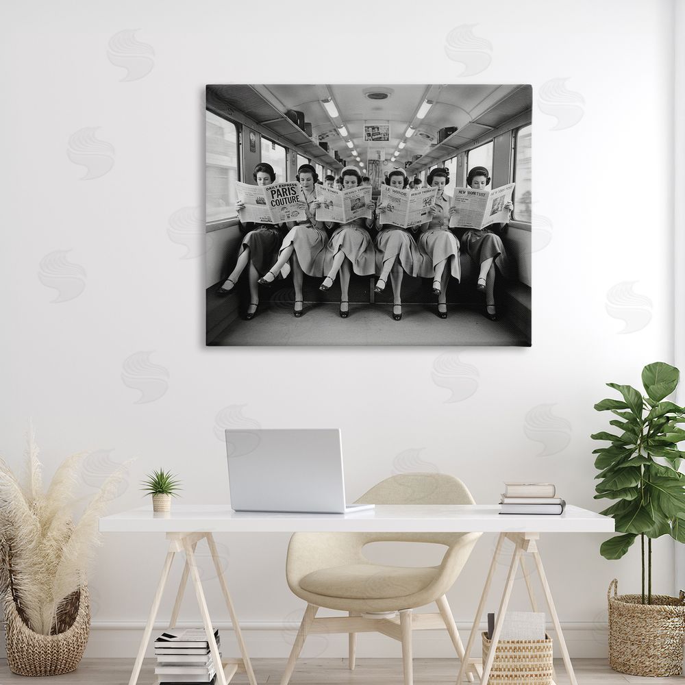 A Barefoot Stylist Newsprint Ladies on Train Stretched Canvas Wall Art in Room