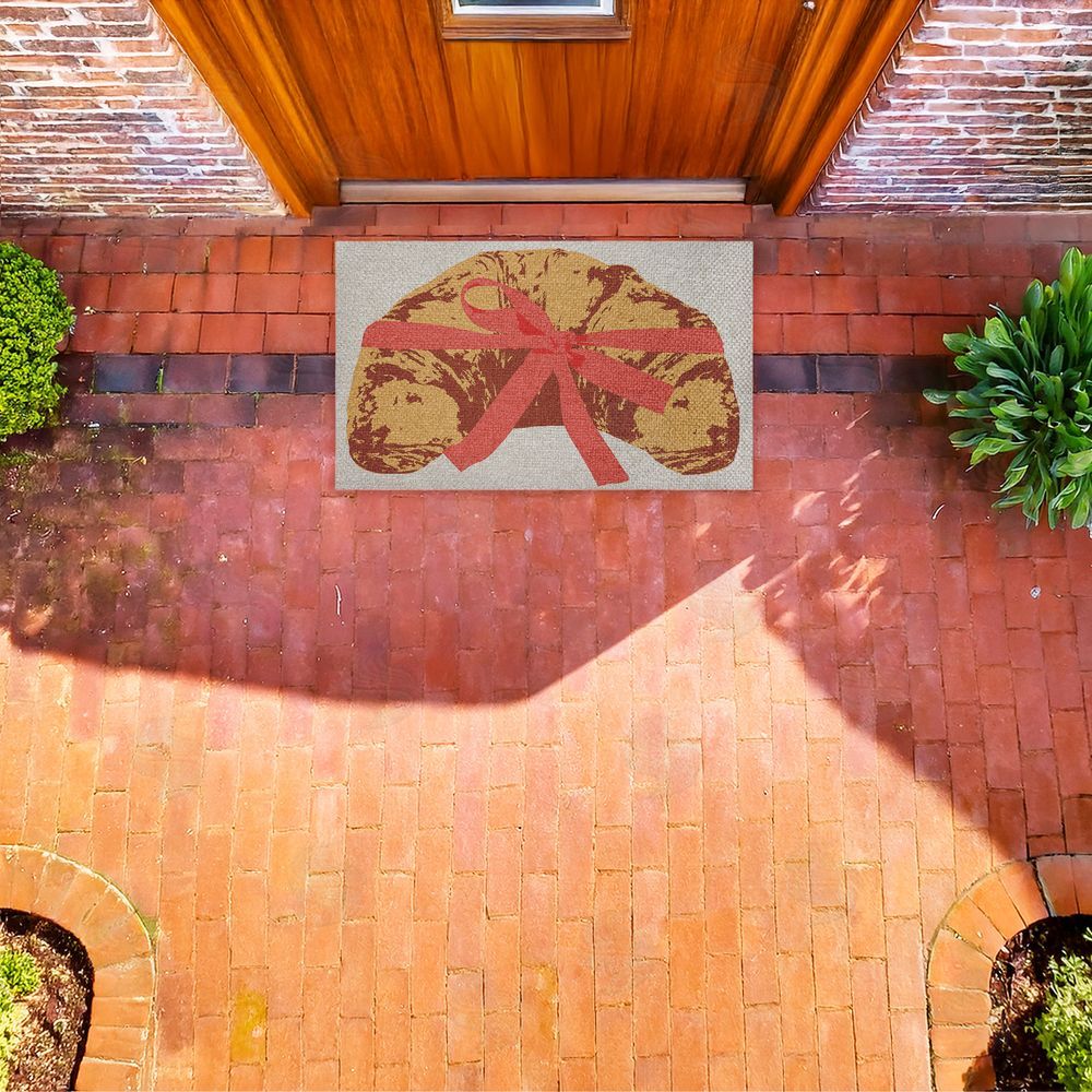 Stupell Studio Bakery Croissant with Ribbon Outdoor Faux Sisal Door Mat