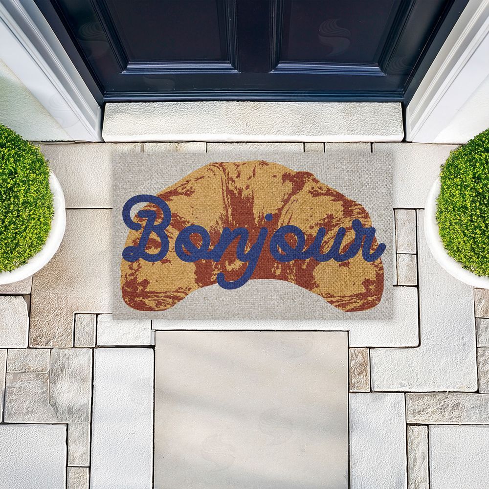 Stupell Studio Bonjour Baked Croissant Outdoor Faux Sisal Door Mat