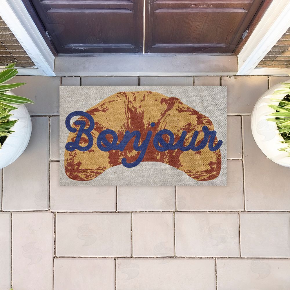 Stupell Studio Bonjour Baked Croissant Outdoor Faux Sisal Door Mat