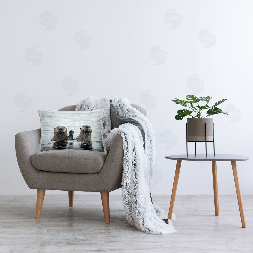 Donna Bourdon Funny Peeking Otters Printed Plush Polyester Throw Pillow On Chair