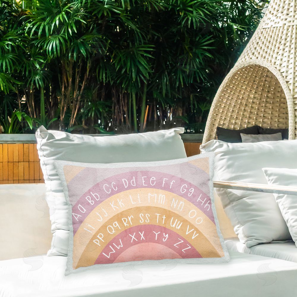 Stupell Studio Pastel Purple Alphabet Outdoor Quick-Dry Polyester Printed Throw Pillow in Back Yard