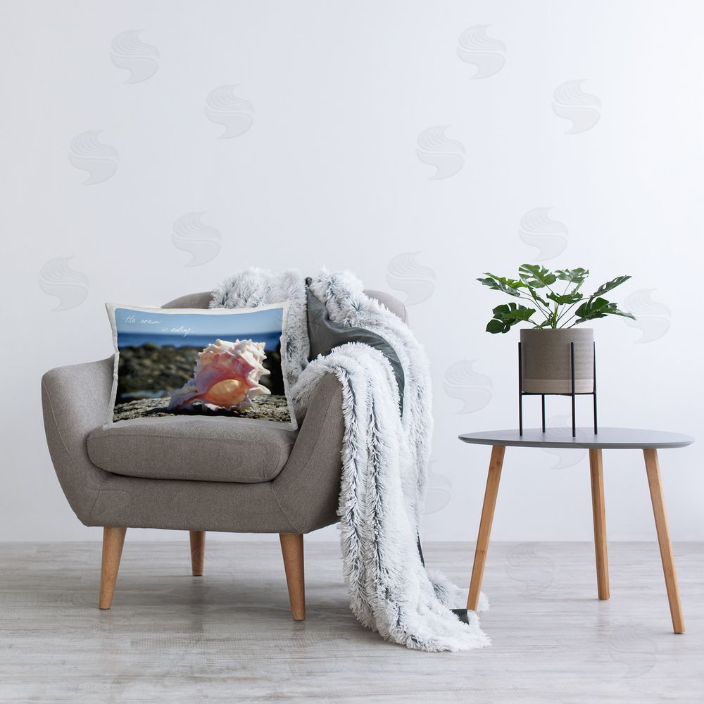 Graffitee Studios Ocean Is Calling Shell Printed Plush Polyester Throw Pillow On Chair
