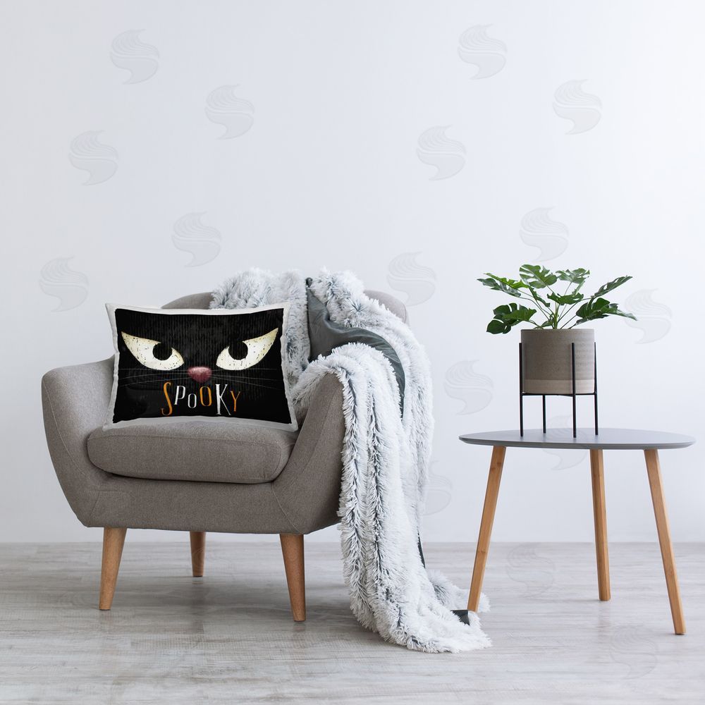 Nicole DeCamp Spooky Cat Eyes Printed Plush Polyester Throw Pillow On Chair