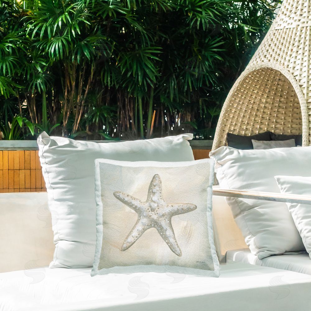 Yvette St. Amant Simple Beige Starfish Outdoor Quick-Dry Polyester Printed Throw Pillow in Back Yard