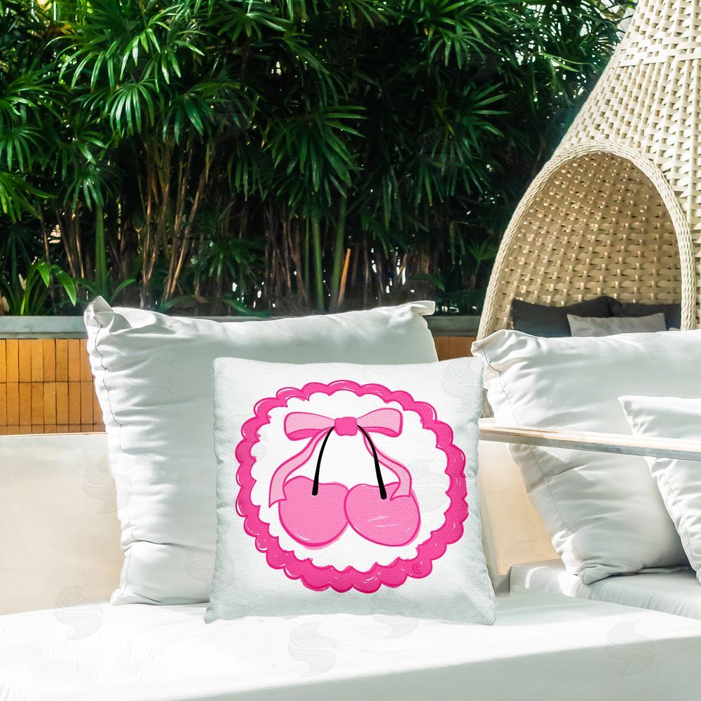 Carrie Cantwell Pink Cherries & Bow Outdoor Quick-Dry Polyester Printed Throw Pillow in Back Yard