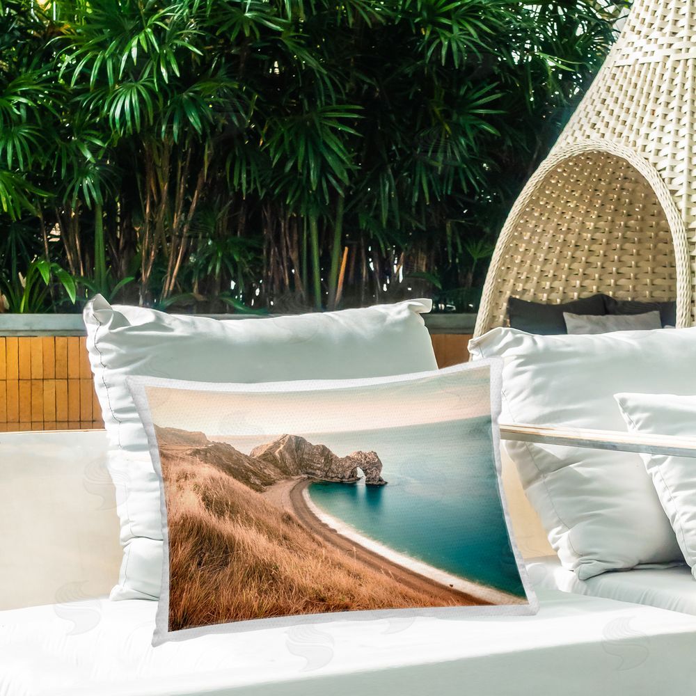 Nataly White Beach With Arched Cove Outdoor Quick-Dry Polyester Printed Throw Pillow in Back Yard