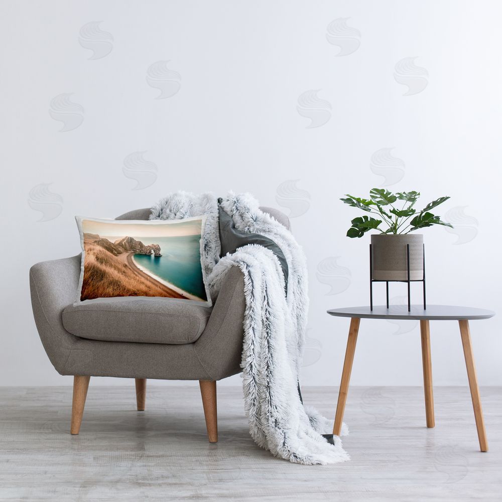 Nataly White Beach With Arched Cove Printed Plush Polyester Throw Pillow On Chair