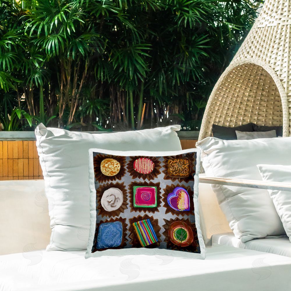 Liz Jardine Mixed Chocolate Pieces Outdoor Quick-Dry Polyester Printed Throw Pillow in Back Yard