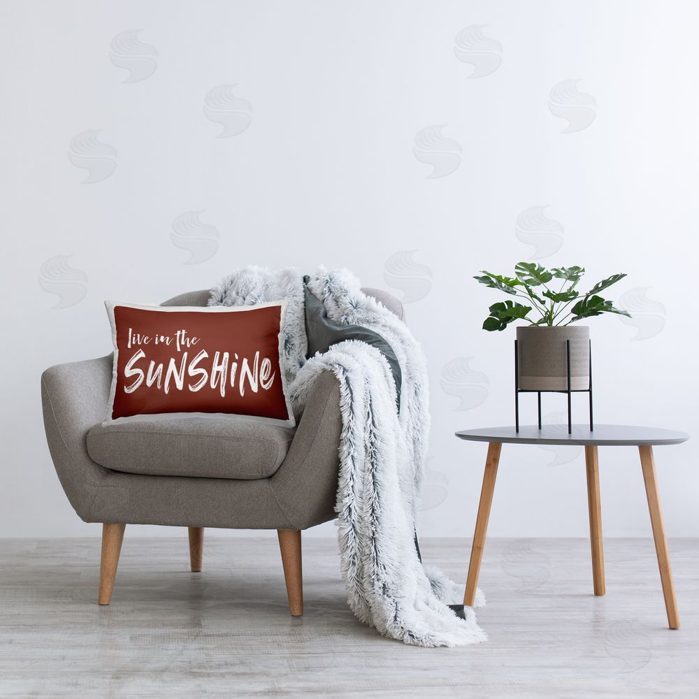 Lettered and Lined Live In The Sunshine Brown Rectugular Printed Throw Pillow on Chair