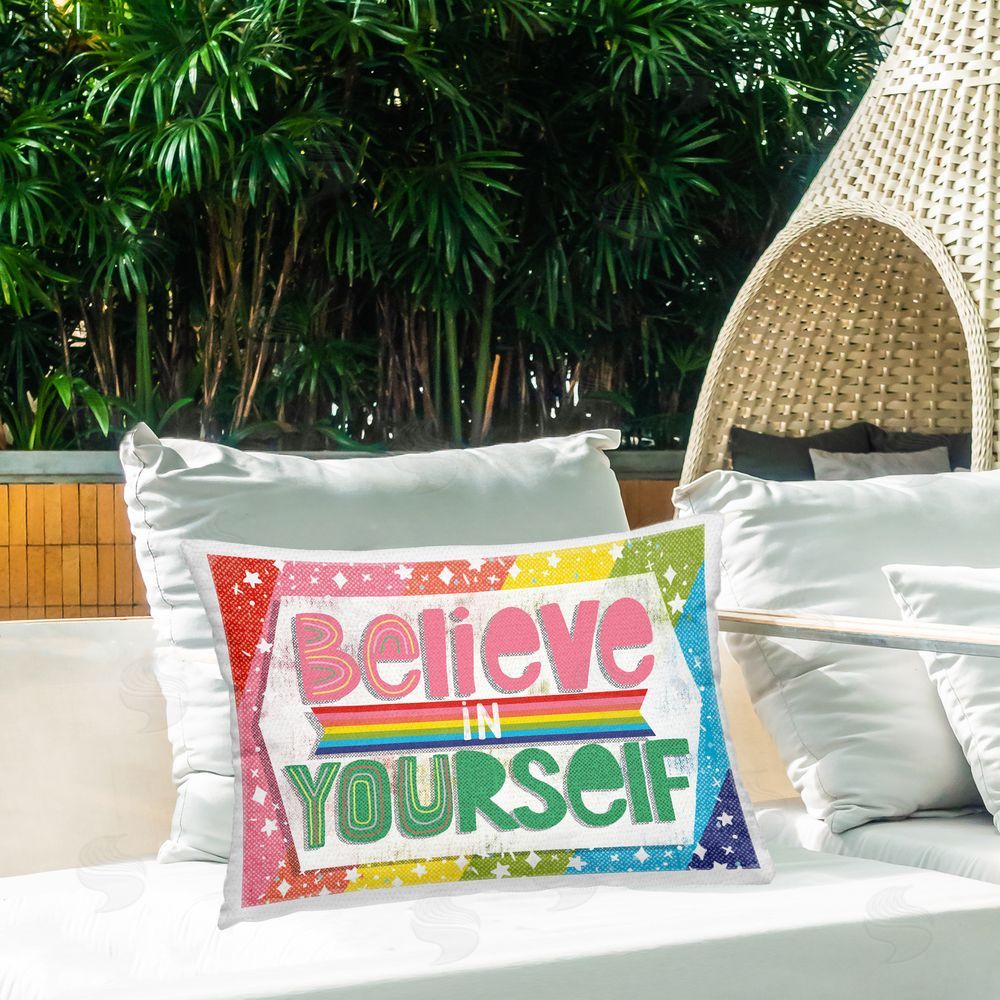 Jilly Jack Designs Believe In Yourself Rainbow Outdoor Printed Throw Pillow on Patio