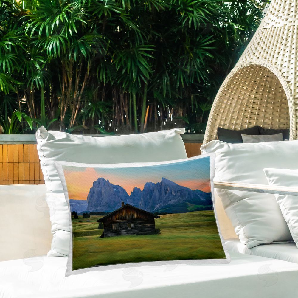 Renel Peters Solitary Cabin with Looming Cliffs Printed Throw Pillow on Patio