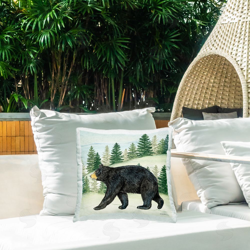 Deb Strain Black Bear In Woods Outdoor Printed Throw Pillow on Patio