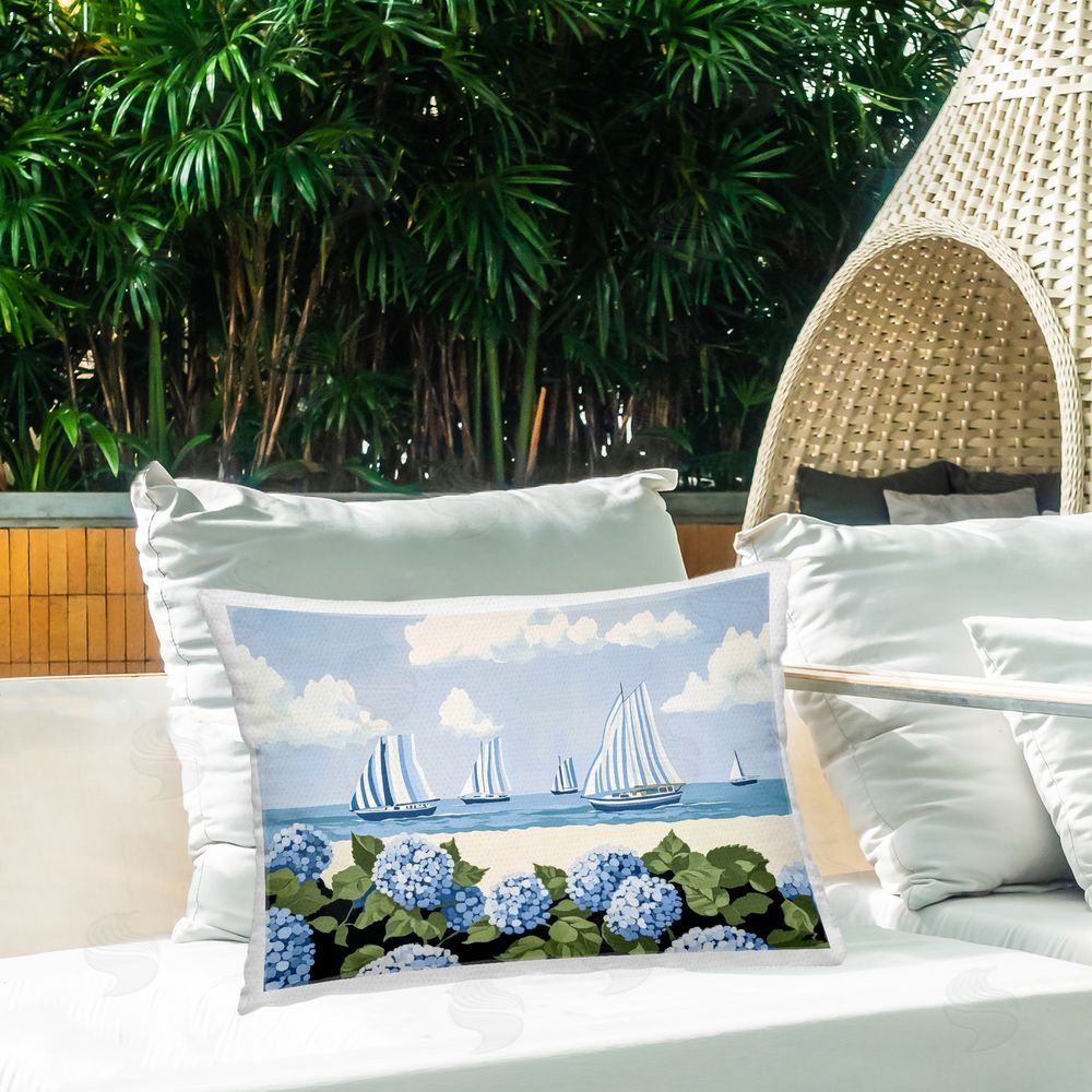 Sisi and Seb Striped Sails & Seaside Hydrangeas Outdoor Printed Lumbar Throw Pillow on Seat