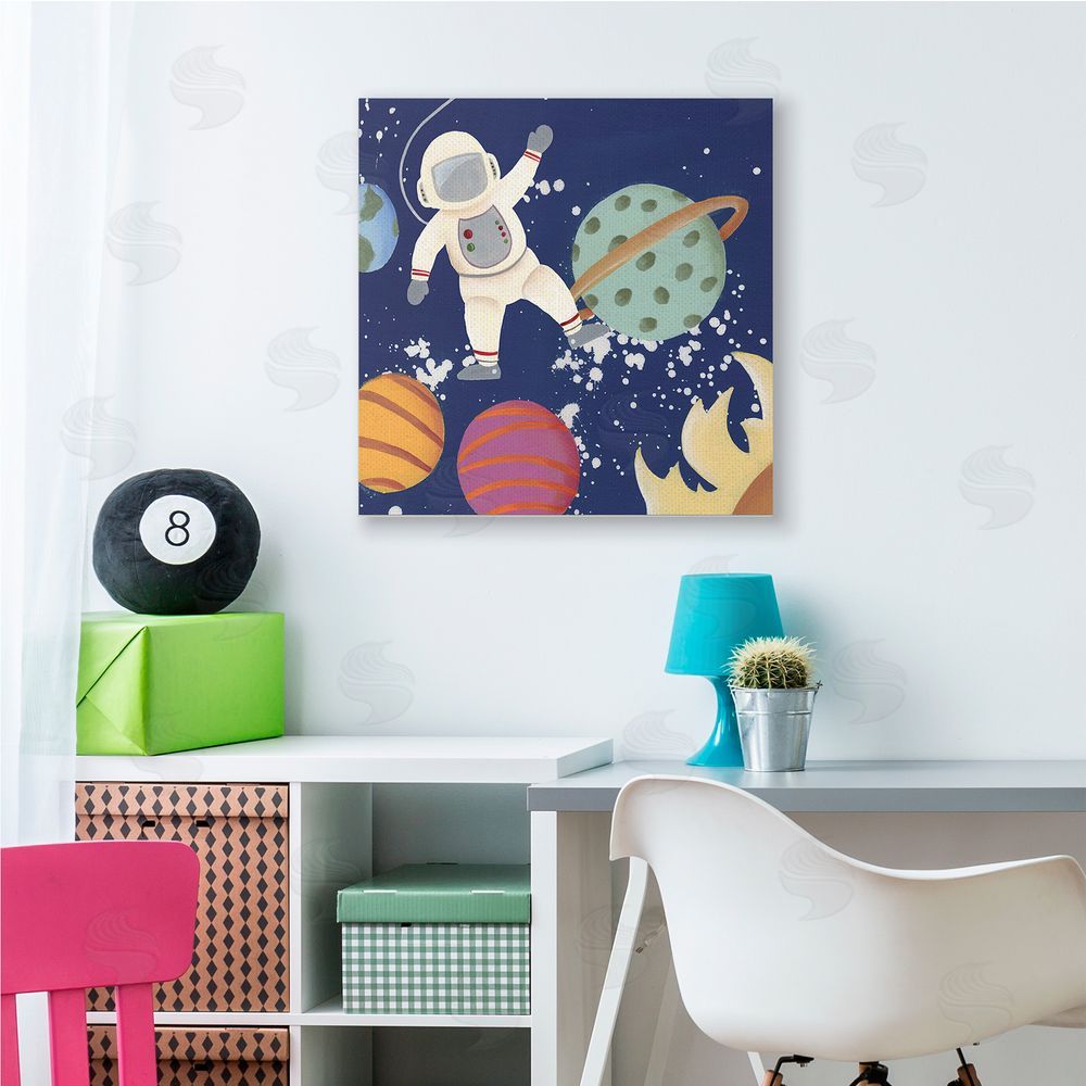 Regina Moore Playful Waving Astronaut Outer Space Adventure Canvas Wall Art in Room