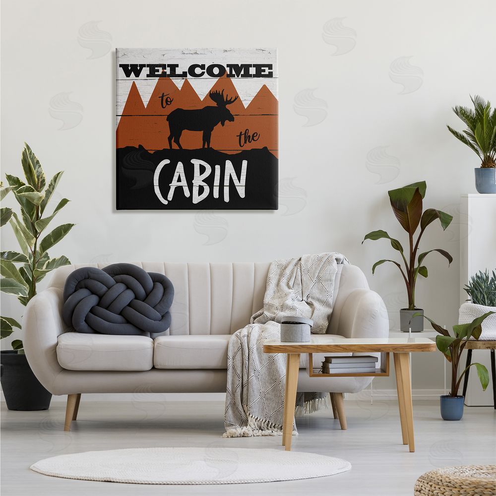 Katrina Craven Welcome To Cabin Phrase Rustic Moose Orange Mountains Canvas Wall Art in Room