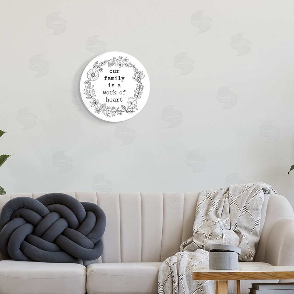 Lettered and Lined Work of Heart Family Phrase Floral Wreath Border Round Wall Plaque Art Print in Room