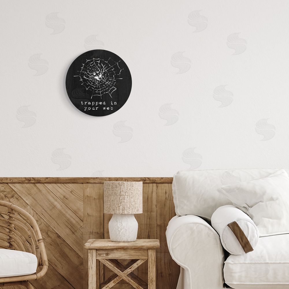 Stupell Studio Trapped In Your Web Humor Round Wall Plaque Art Print in Room