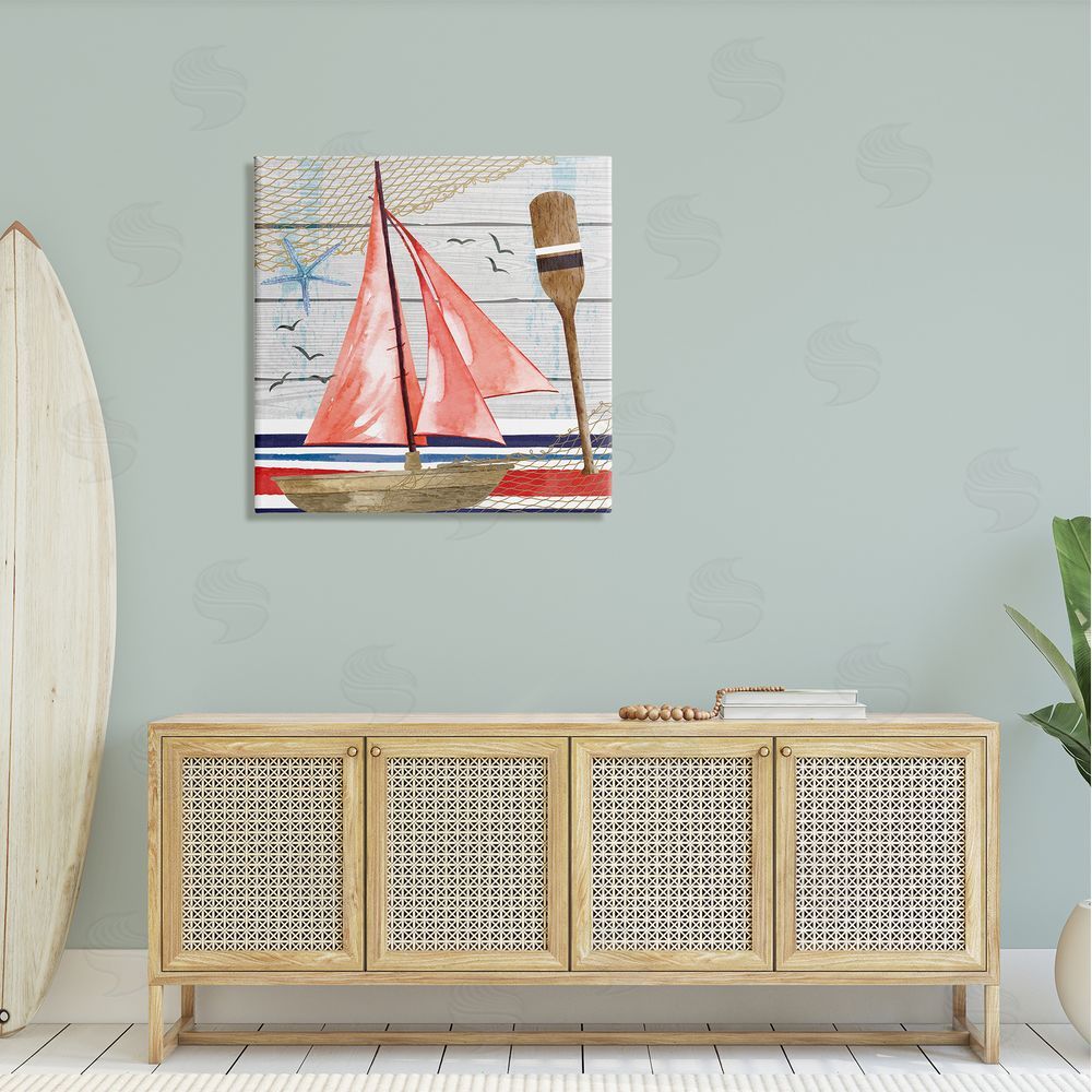 Nicole DeCamp Coastal Plank Pattern Sailboat Canvas Wall Art in Room