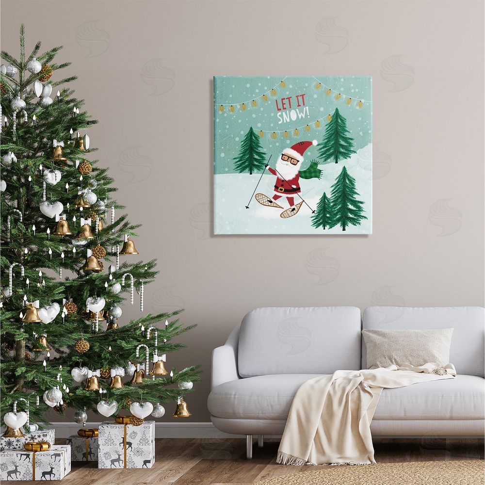 Pan Georgiou Let It Snow Santa Snowshoeing Canvas Wall Art in Room