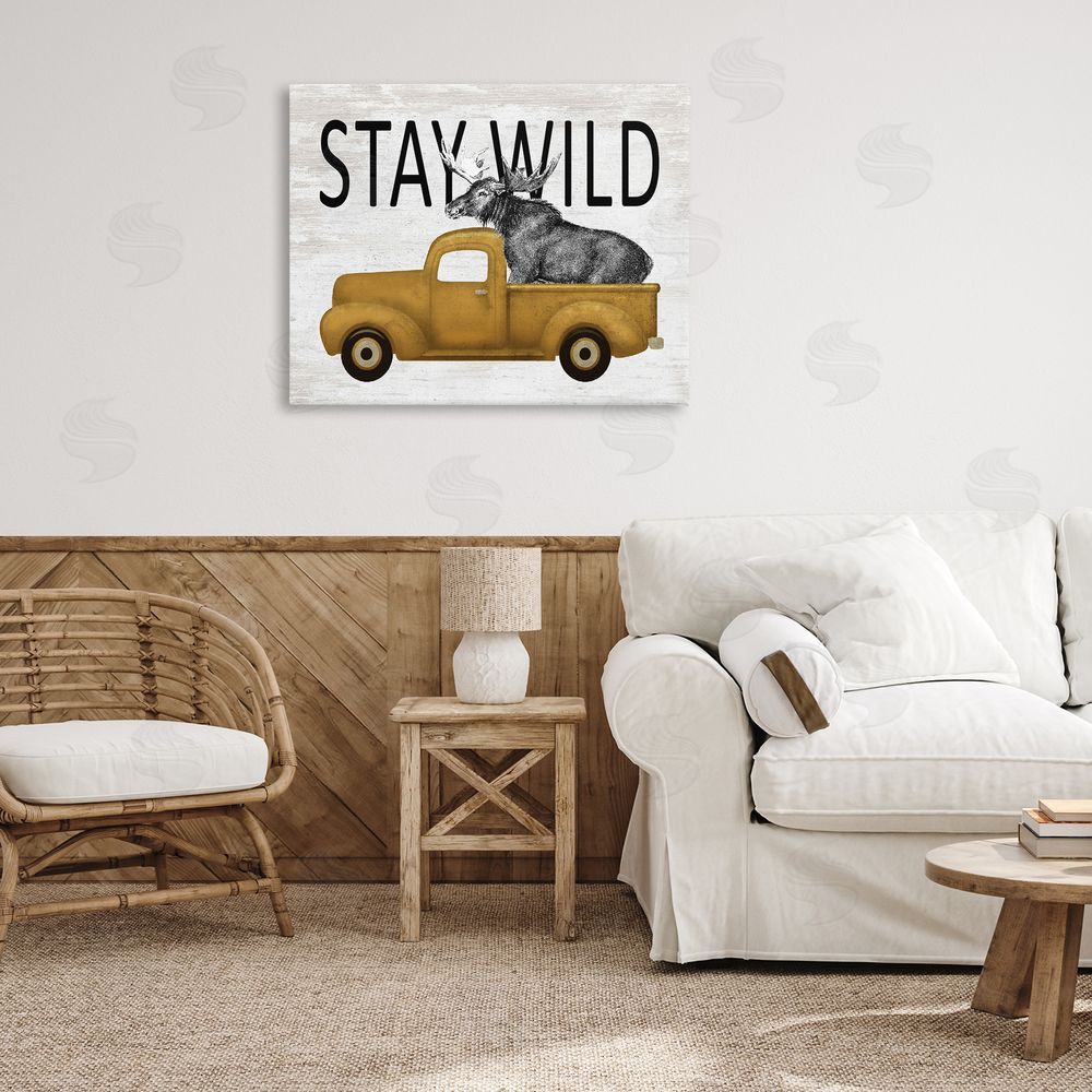 Lettered and Lined Stay Wild Moose Truck Stretched Canvas Wall Art Print in Room