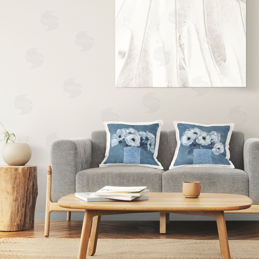 Janet Tava Blue and White Poppies Printed Plush Polyester Throw Pillow On Chair