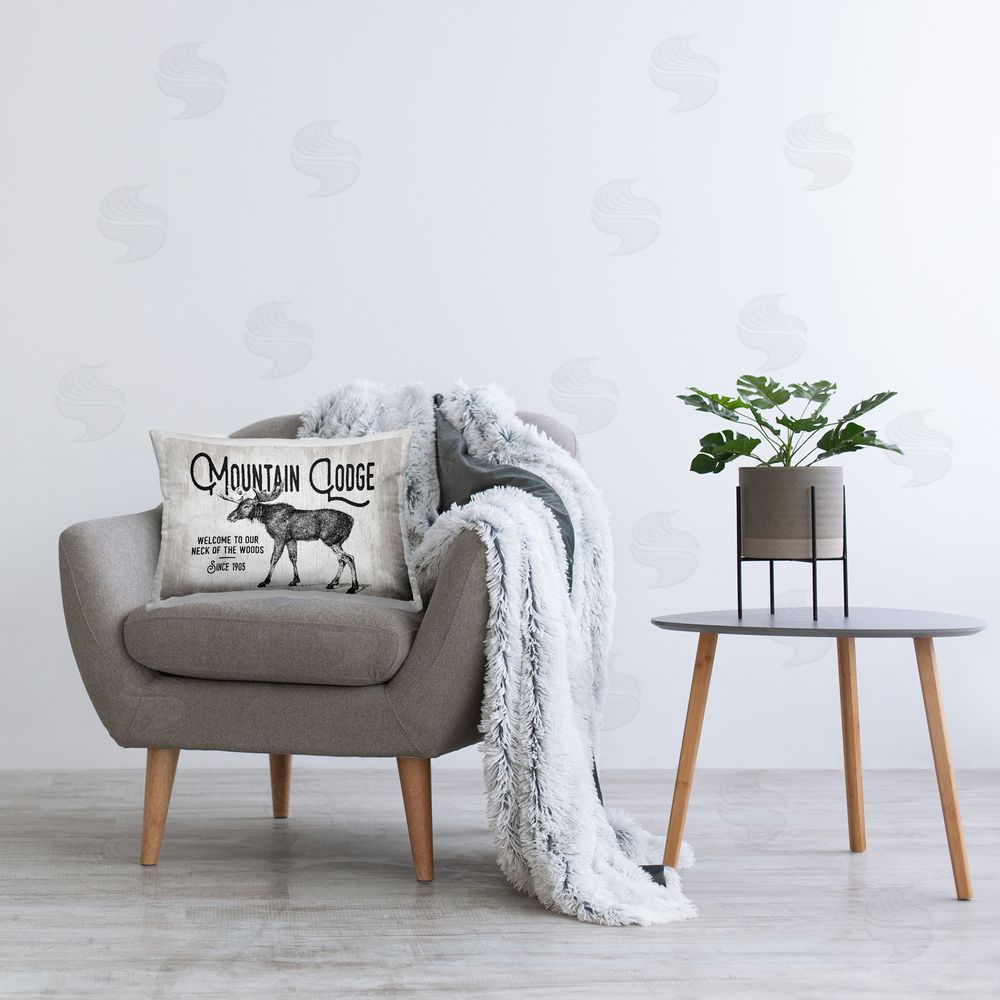 Lettered and Lined Mountain Lodge Moose Printed Plush Polyester Throw Pillow On Chair