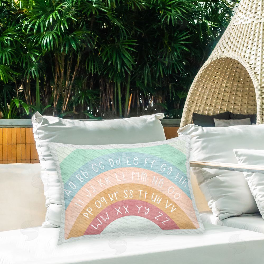 Stupell Studio Rainbow Alphabet Letters Outdoor Quick-Dry Polyester Printed Throw Pillow in Back Yard