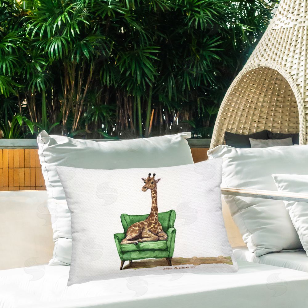 George Dyachenko Cute Giraffe on Green Chair Outdoor Printed Throw Pillow on Patio
