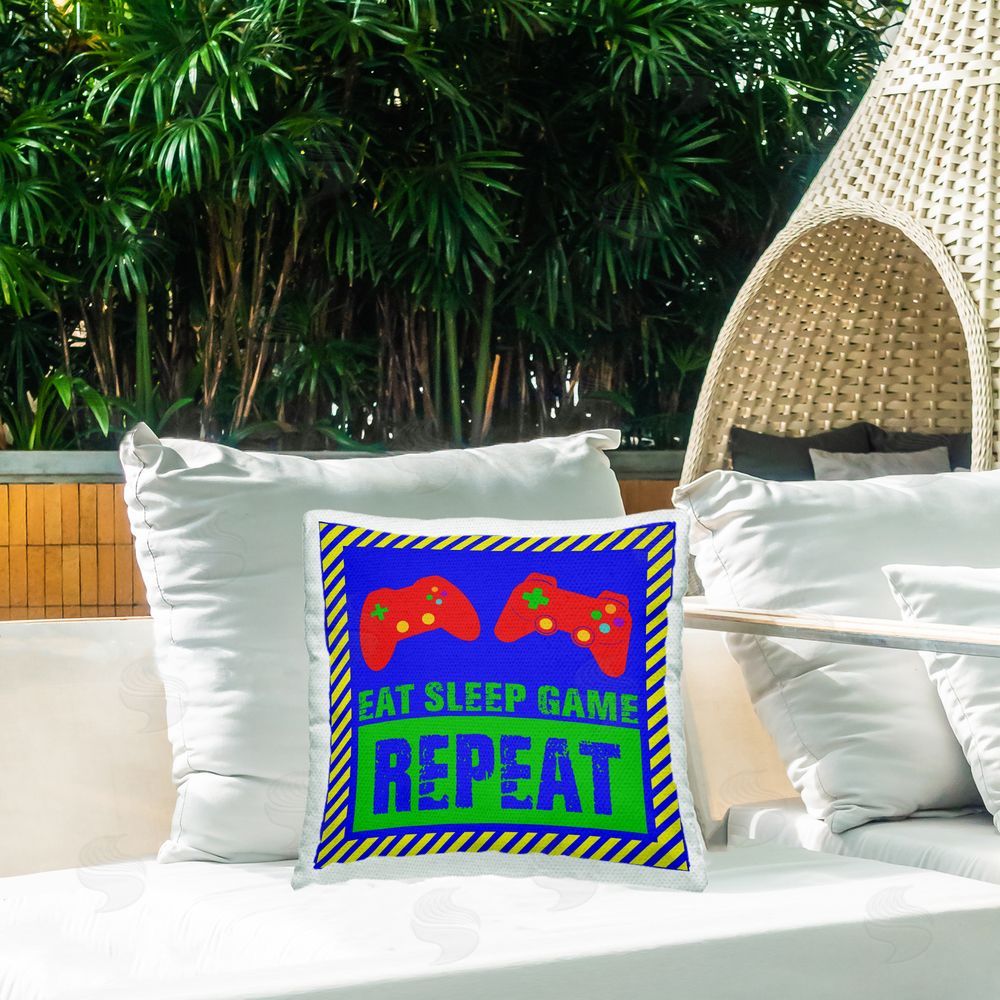 Marcus Prime Vibrant Eat Sleep Game Repeat Outdoor Printed Throw Pillow on Patio