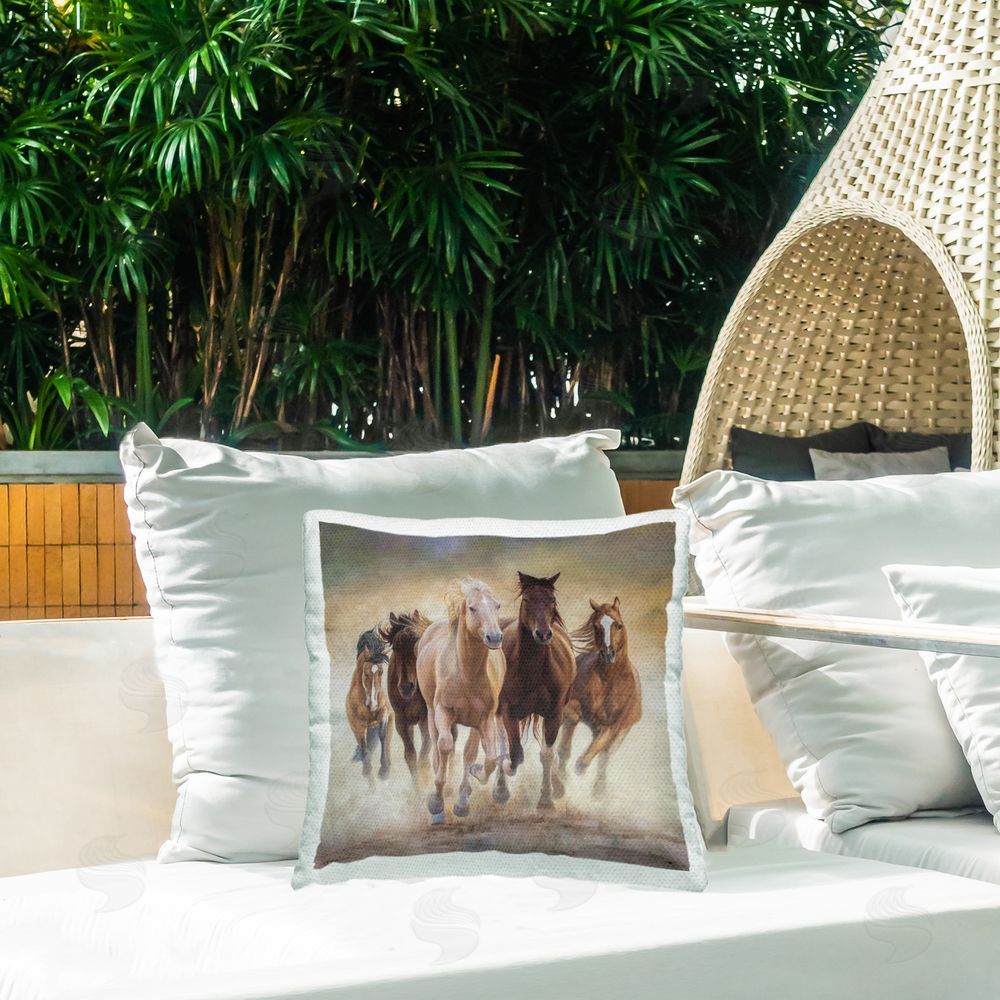 James Corwin Strong Galloping Horses Outdoor Printed Throw Pillow on Patio