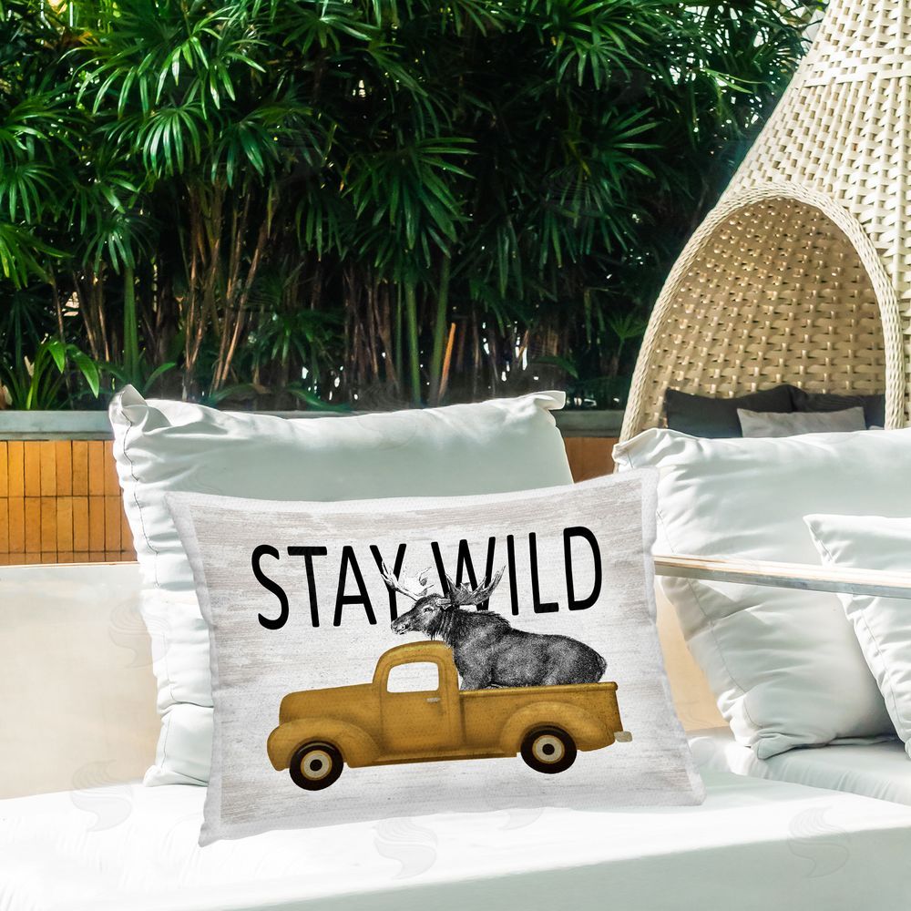Lettered and Lined Stay Wild Moose Truck Outdoor Rectugular Printed Throw Pillow on Patio
