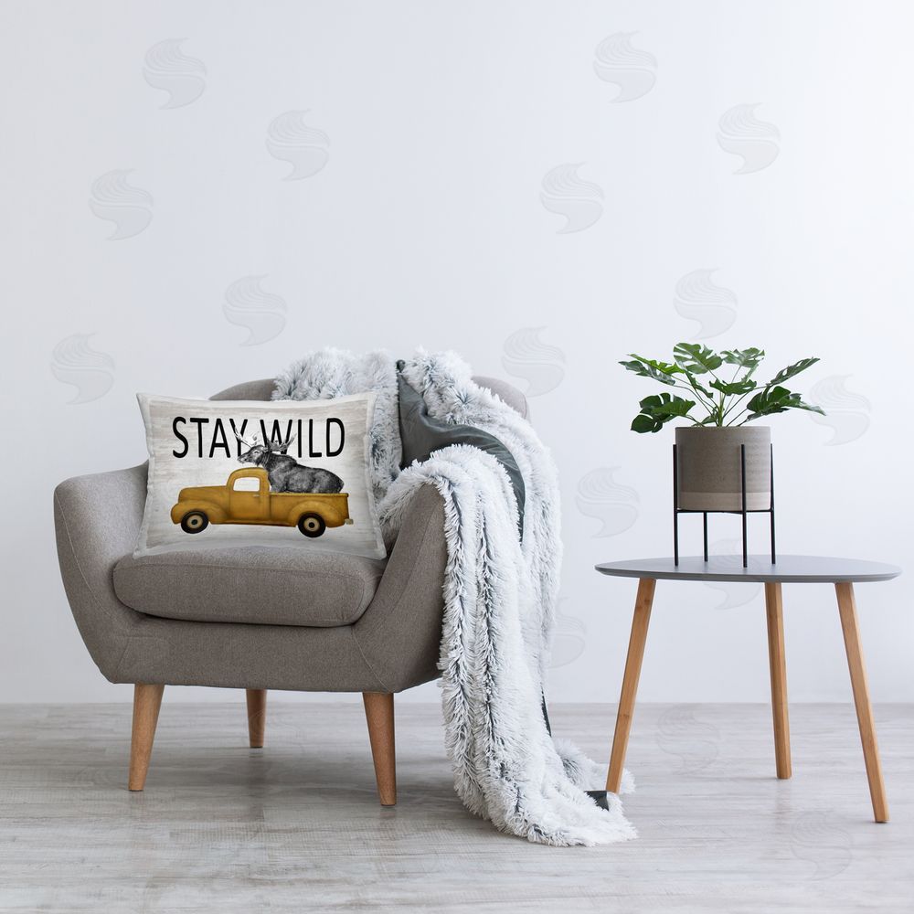 Lettered and Lined Stay Wild Moose Truck Rectugular Printed Throw Pillow on Chair
