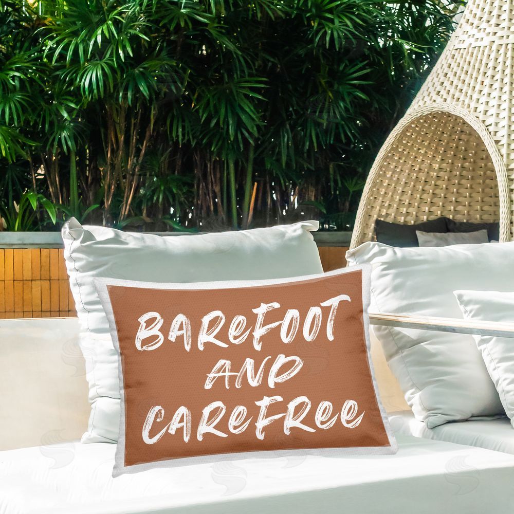 Lettered and Lined Barefoot & Carefree Brown Outdoor Rectugular Printed Throw Pillow on Patio