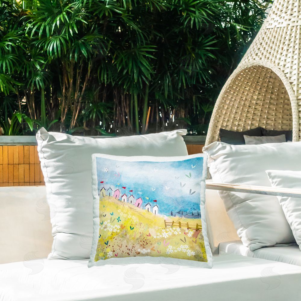 Clare Tupper Beach Huts on Hillside Outdoor Printed Throw Pillow on Patio