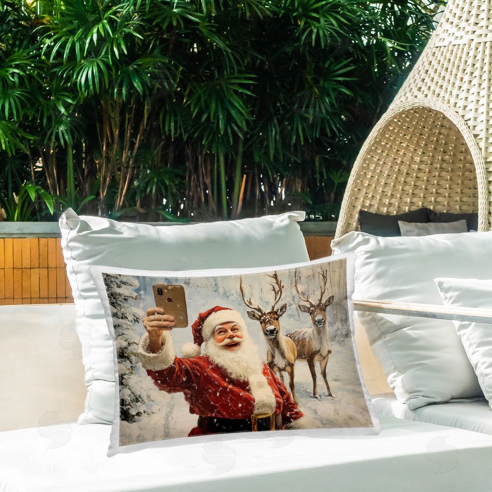 Arlington Prints Santa & Reindeer Selfie Outdoor Rectugular Printed Throw Pillow on Patio